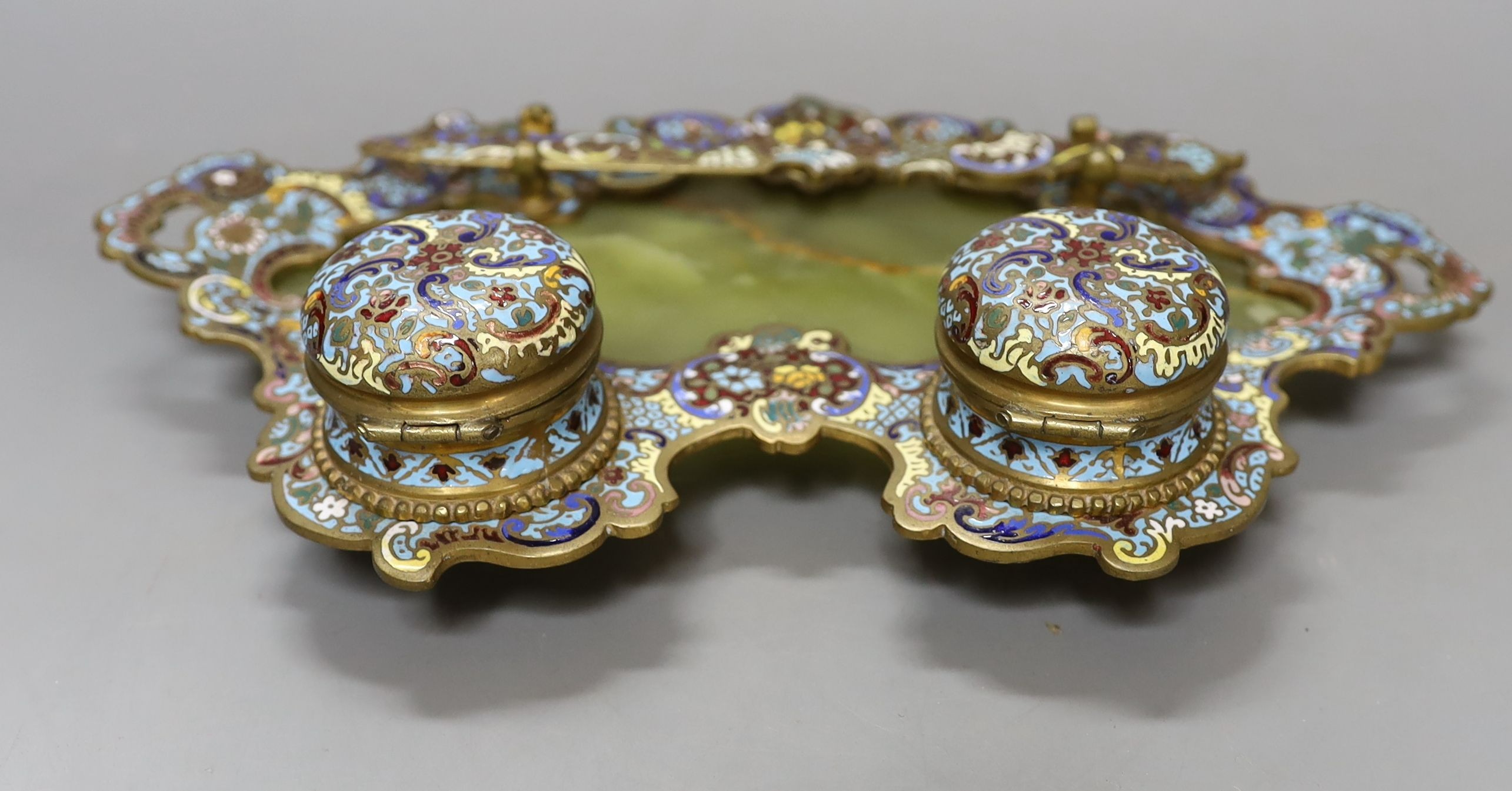 A French onyx and champleve-enamel deskstand, with paper-knife, 27cm wide, together with a similar inkstand